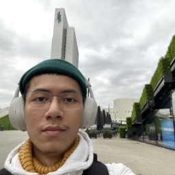 selfie of Nay Min Ko wearing a pair of headphones over a beanie